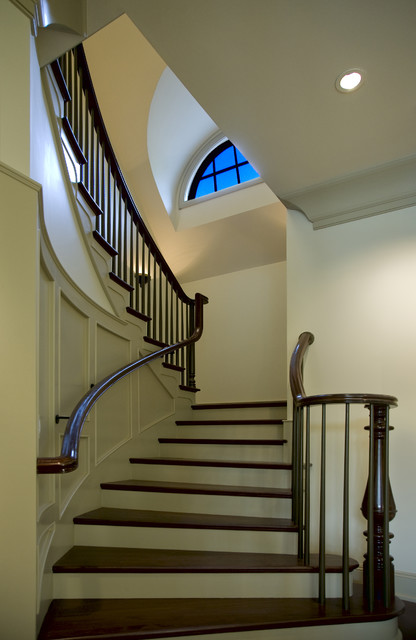 Современный дизайн оформления лестницы в контрастных цветах.