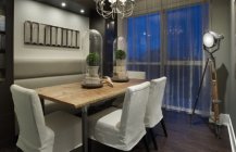 Современный стиль оформления столовой комнаты в серых тонах.